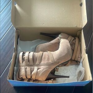 Selling some Michael Kors heel boots. They have been worn